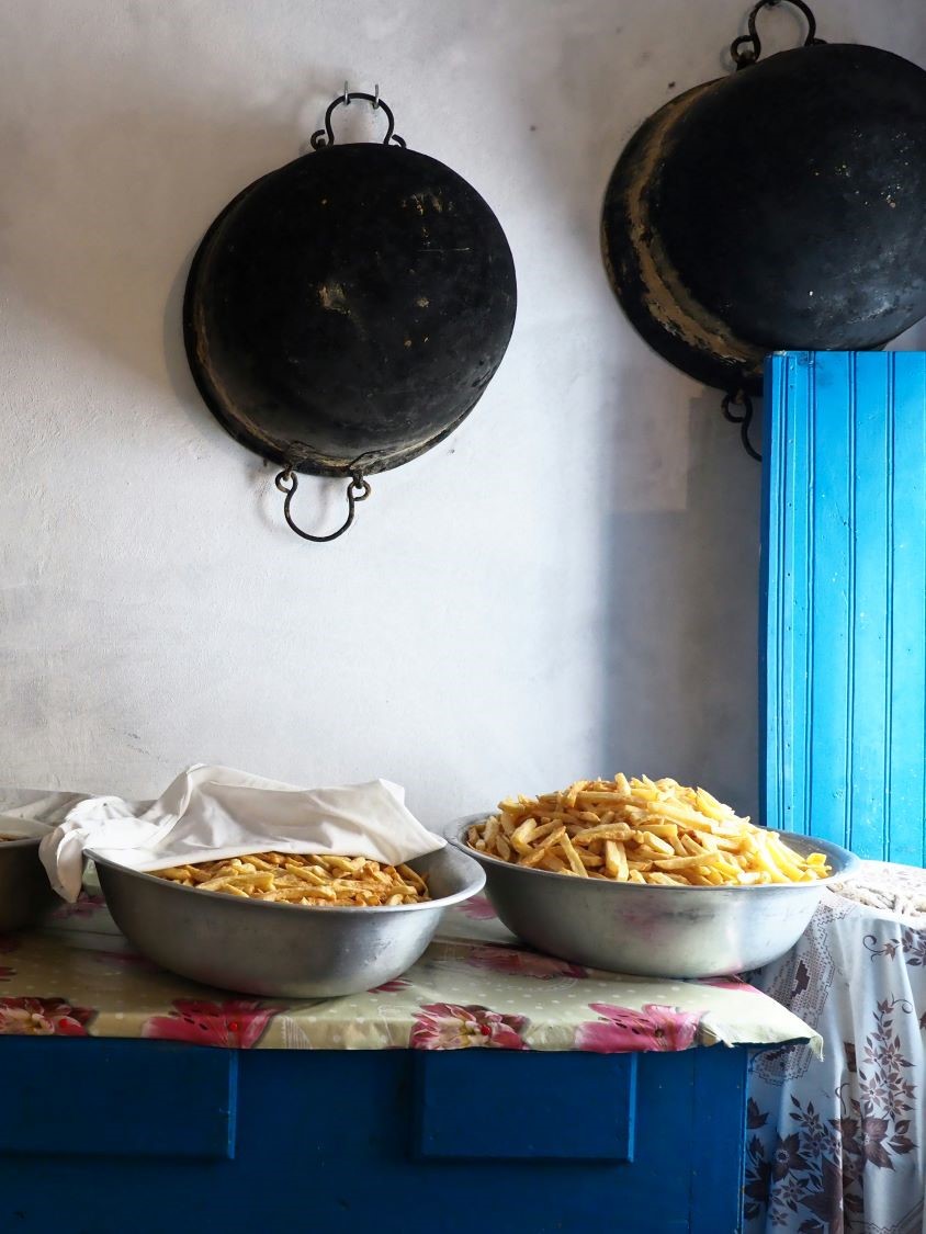 Cheeses of the South Aegean: Bowls of pasta beneath hanging pans in a Kasos kitchen