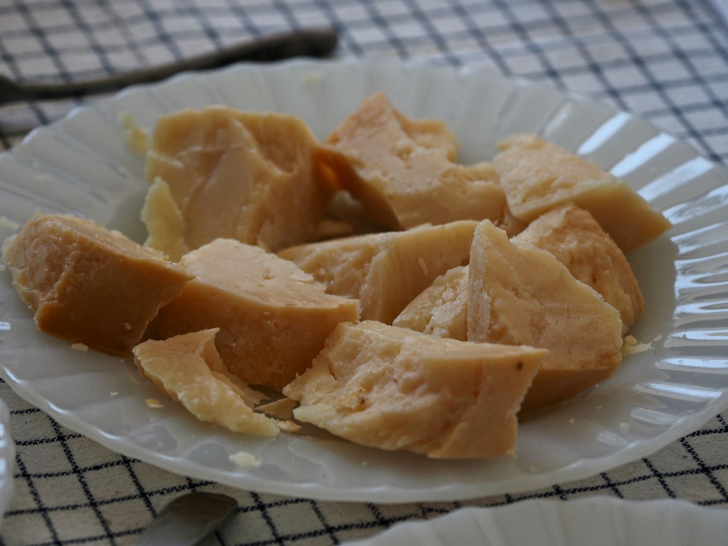 Cheeses of the South Aegean: Pieces of aged hard cheese from Milos on a plate