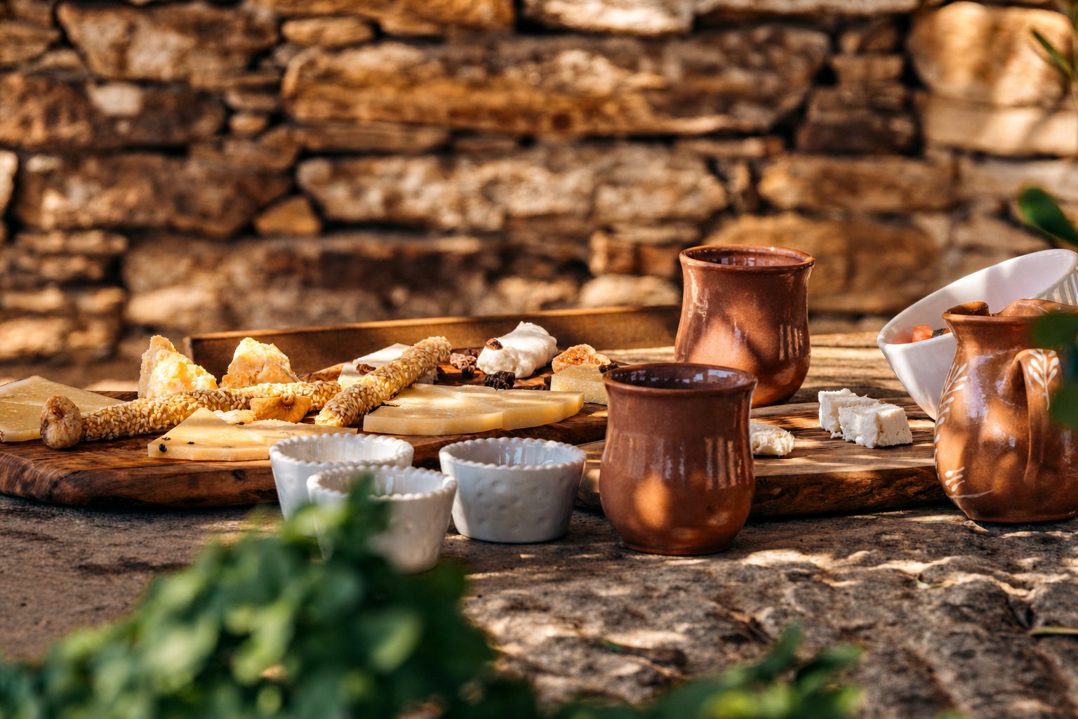 Cheeses of the South Aegean: Cheeses and traditional foods on a rustic table on Ios
