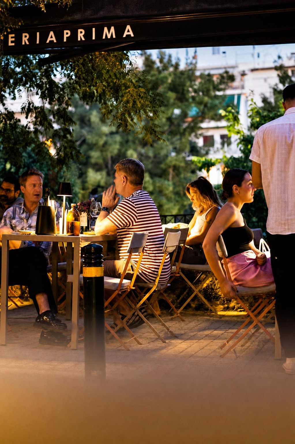 Koukaki&rsquo;s Best Places to Eat: Materia Prima, guests dining at outdoor tables