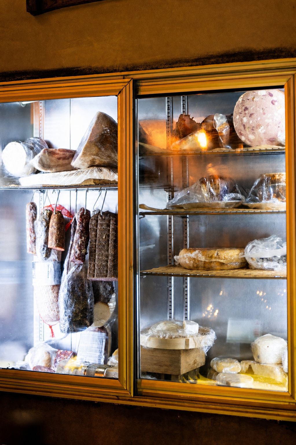 Koukaki&rsquo;s Best Places to Eat: Drupes Spritzeria, cheeses and cured meats in a refrigerated display